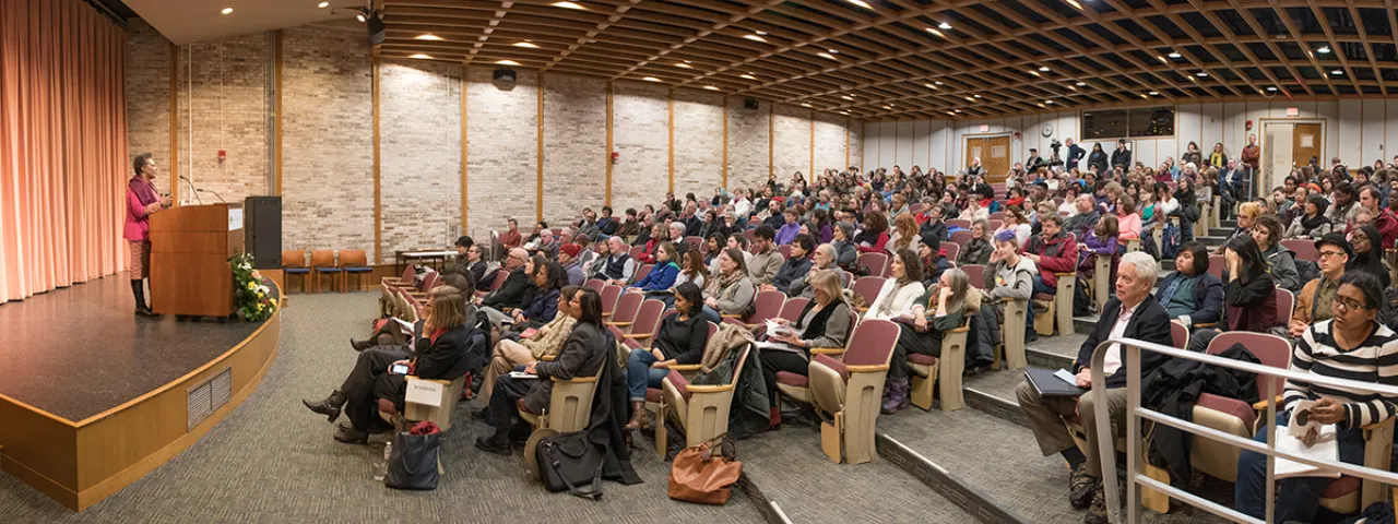 Claudia Rankine reading to an audience in Weinstein Auditorium