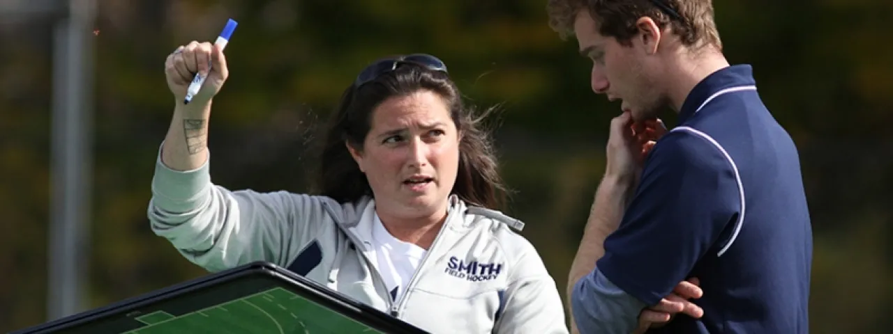 Smith College coaches discuss strategy on the field