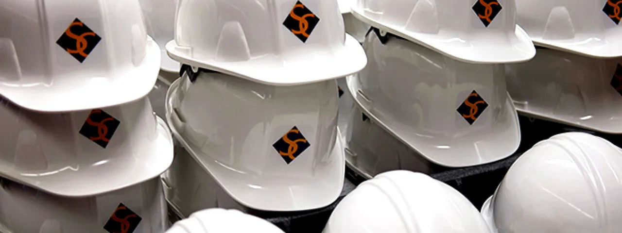Group of hard hats bearing the Smith College logo