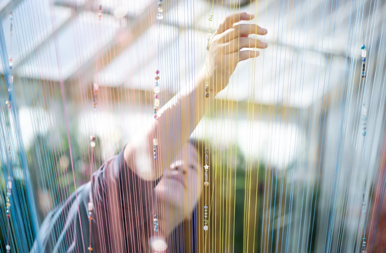 blurred photo with a student working in the background