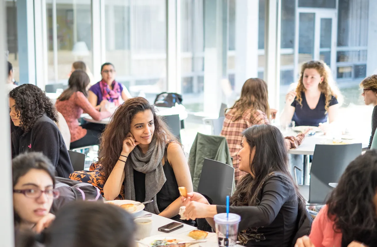 Two students chatting in the Cutter-Ziskind dining room