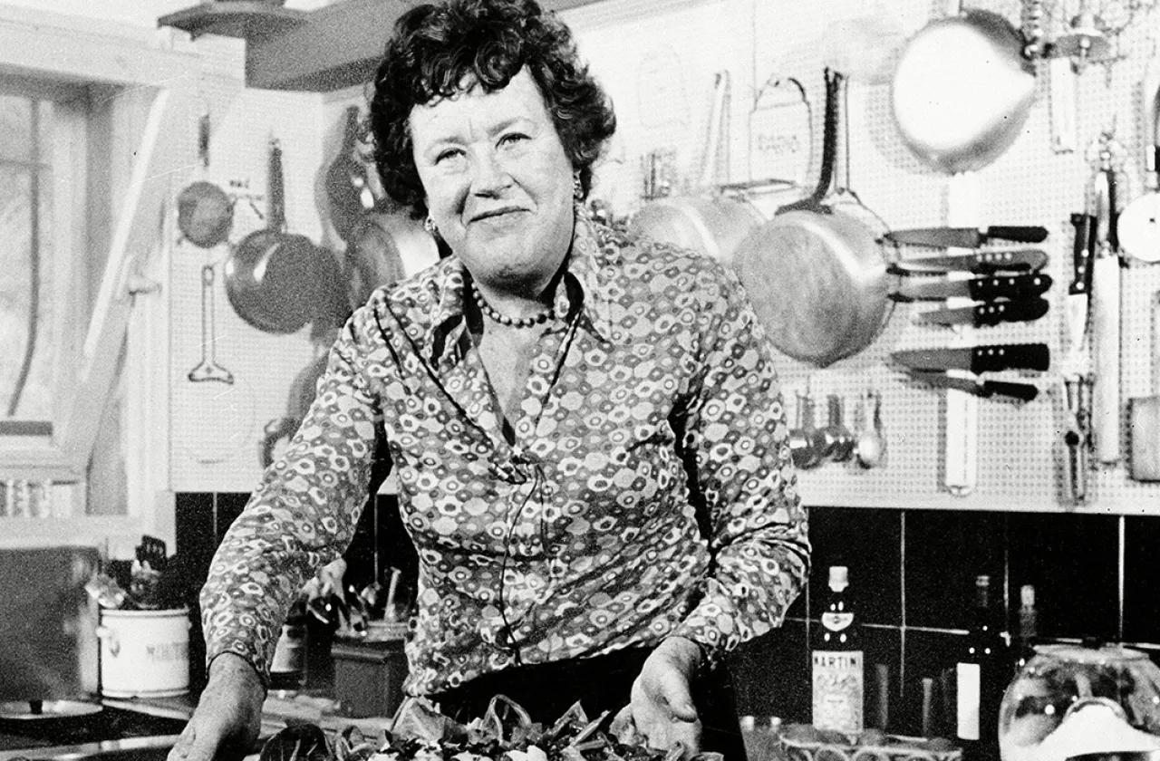 Julia Child presenting a finished dish