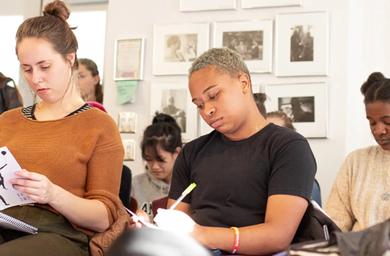 A group of students studying poetry