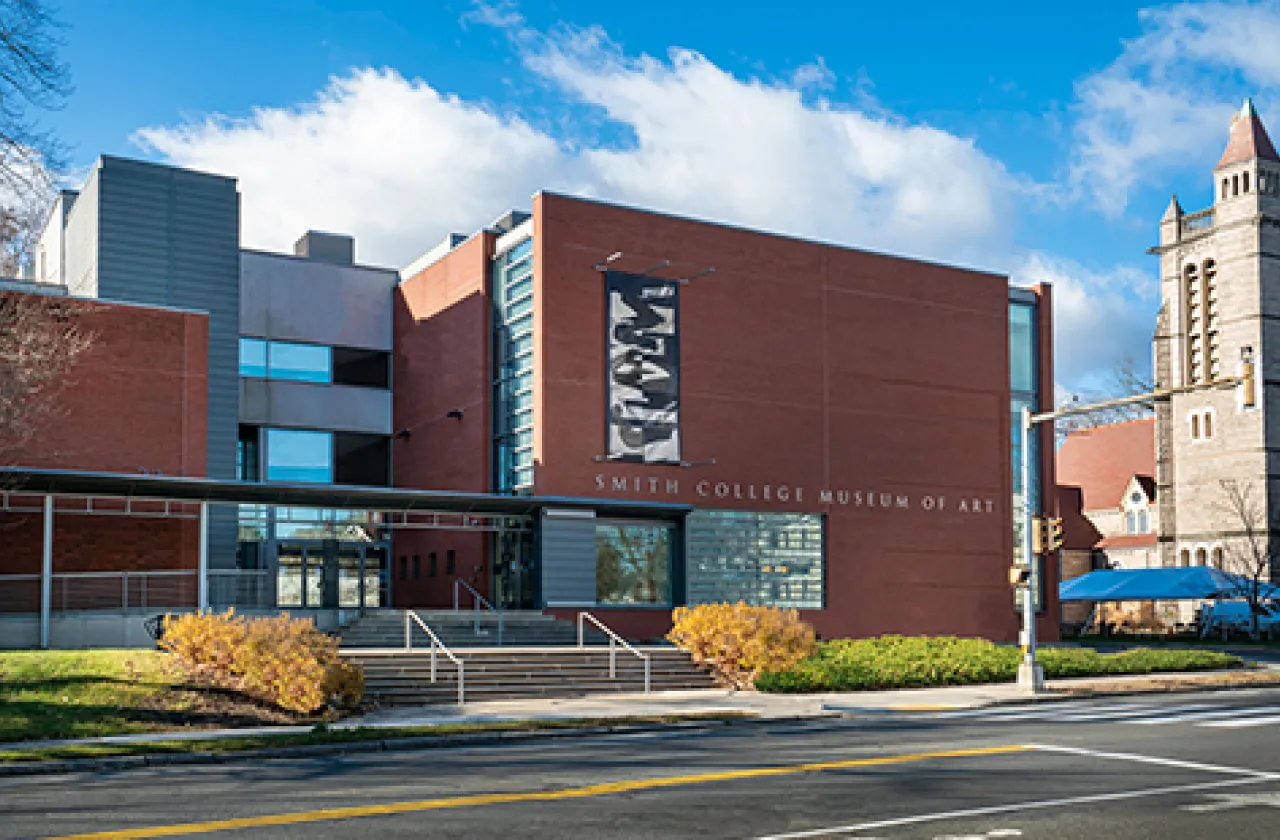 Art museum exterior with black and white banner by artist Amanda Williams with abstract shapes on the front of building 