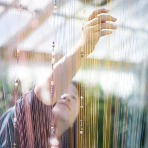 blurred photo with a student working in the background