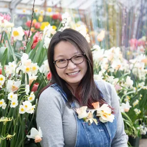 student posing with the bulbs 