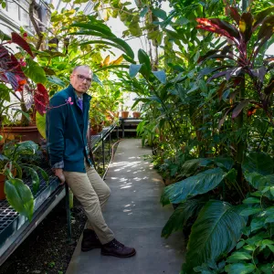 Tim Johnson in a greenhouse