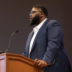 Author Tony Jack at the podium for the Inclusion in Action conference