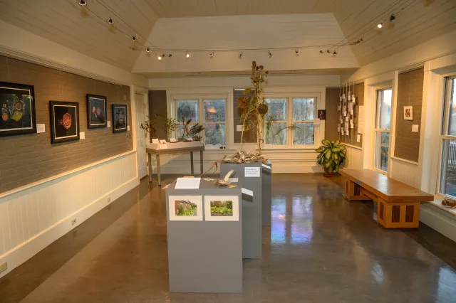 gallery space with gray floors and white  walls