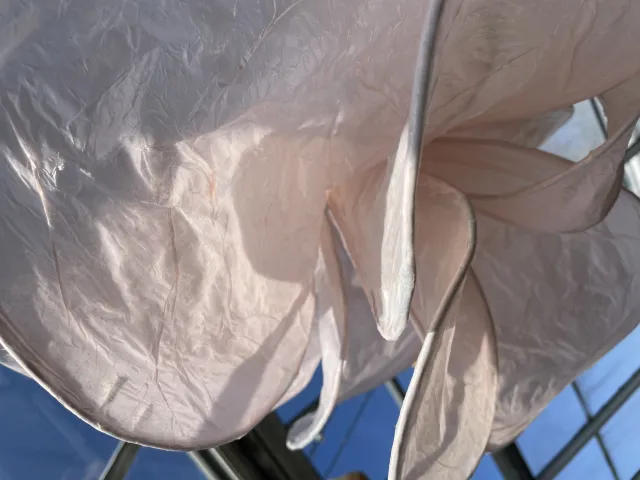 metal flower structure with pink tissue paper on the petals