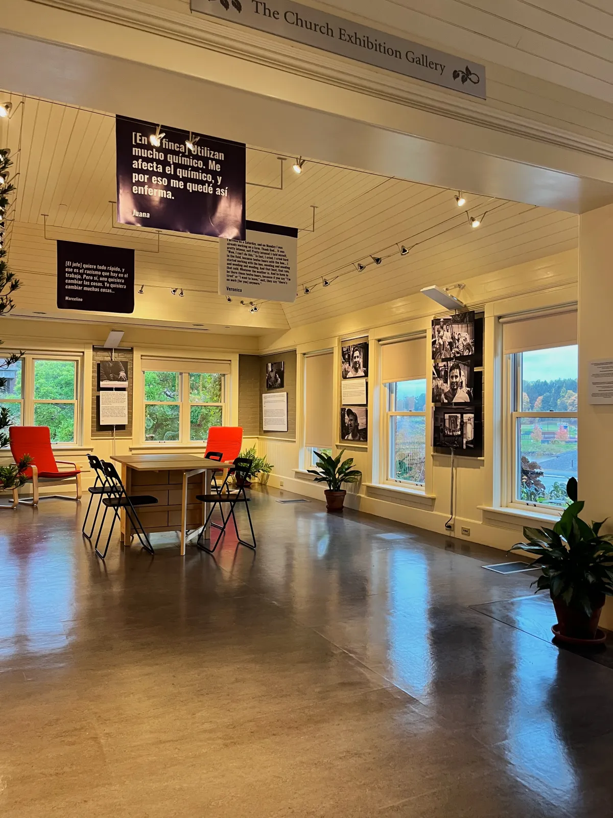 Exhibit space with table and chairs.
