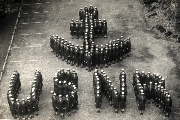 WAVES standing in the shape of USNR and an anchor