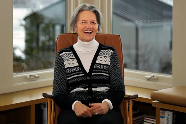 Margaret Wurtele seated in a chair in her house