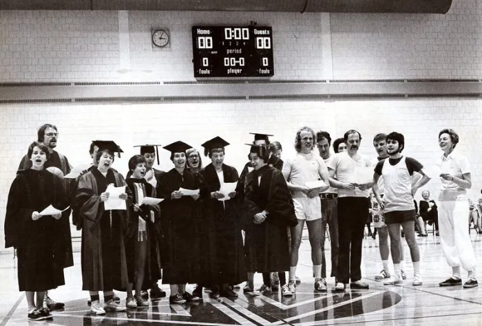 Faculty members on the basketball court.