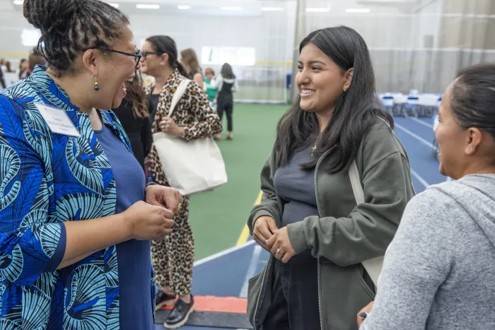 President Sarah Willie-LeBreton greets a new student at Central Check-In