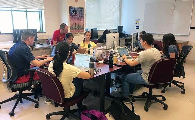 Students in a computer science classroom