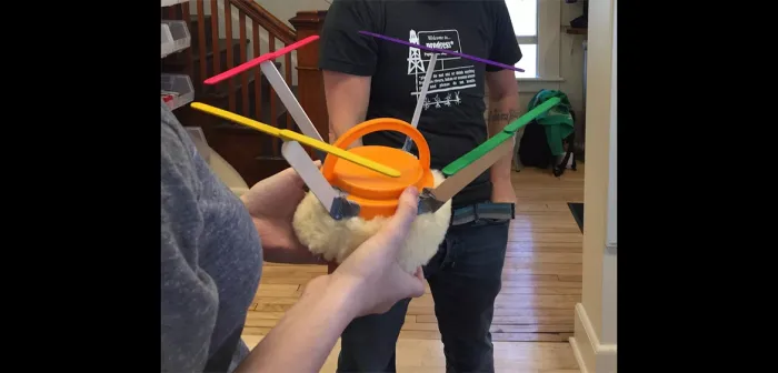 Students holding a soft drone prototype