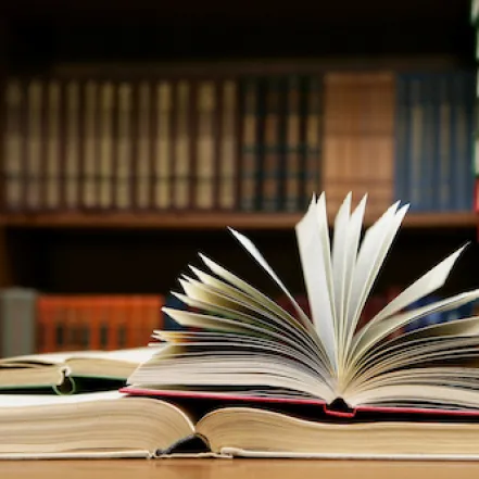 Library desk with open book