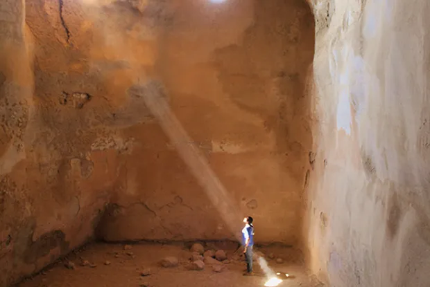 Photo of a student standing in a ray of sunlight in Israel