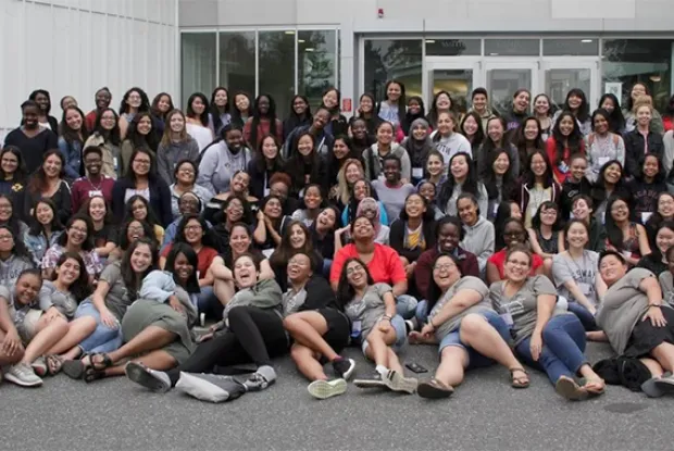 Group photo of Bridge participants in front of the campus center